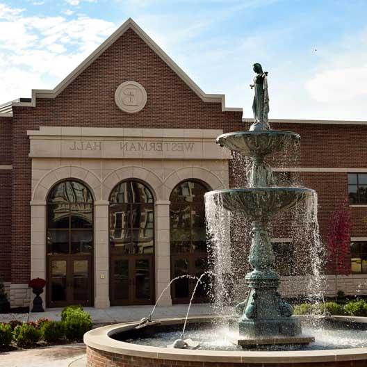 Our Lady of Grace Fountain with the Westerman Hall facade behind